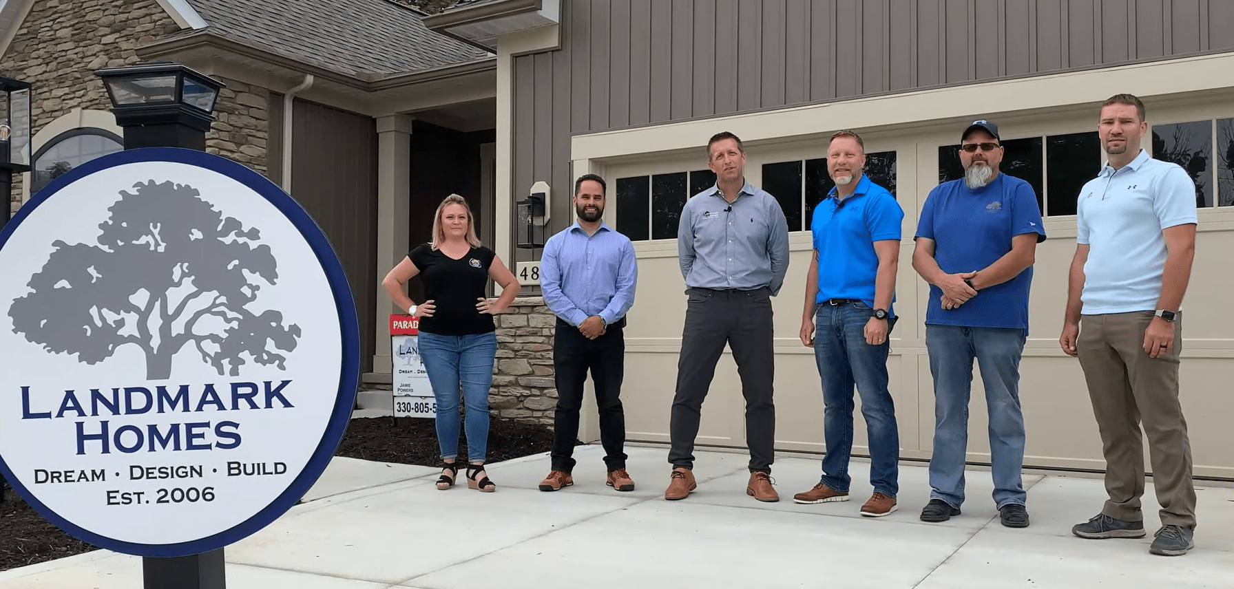 Landmark Homes team together at a completed home in Medina, Ohio